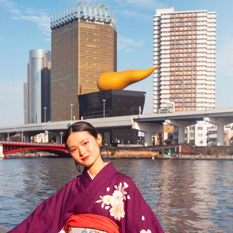 Japanese Woman with Asahi Beer Hall and Golden Flame